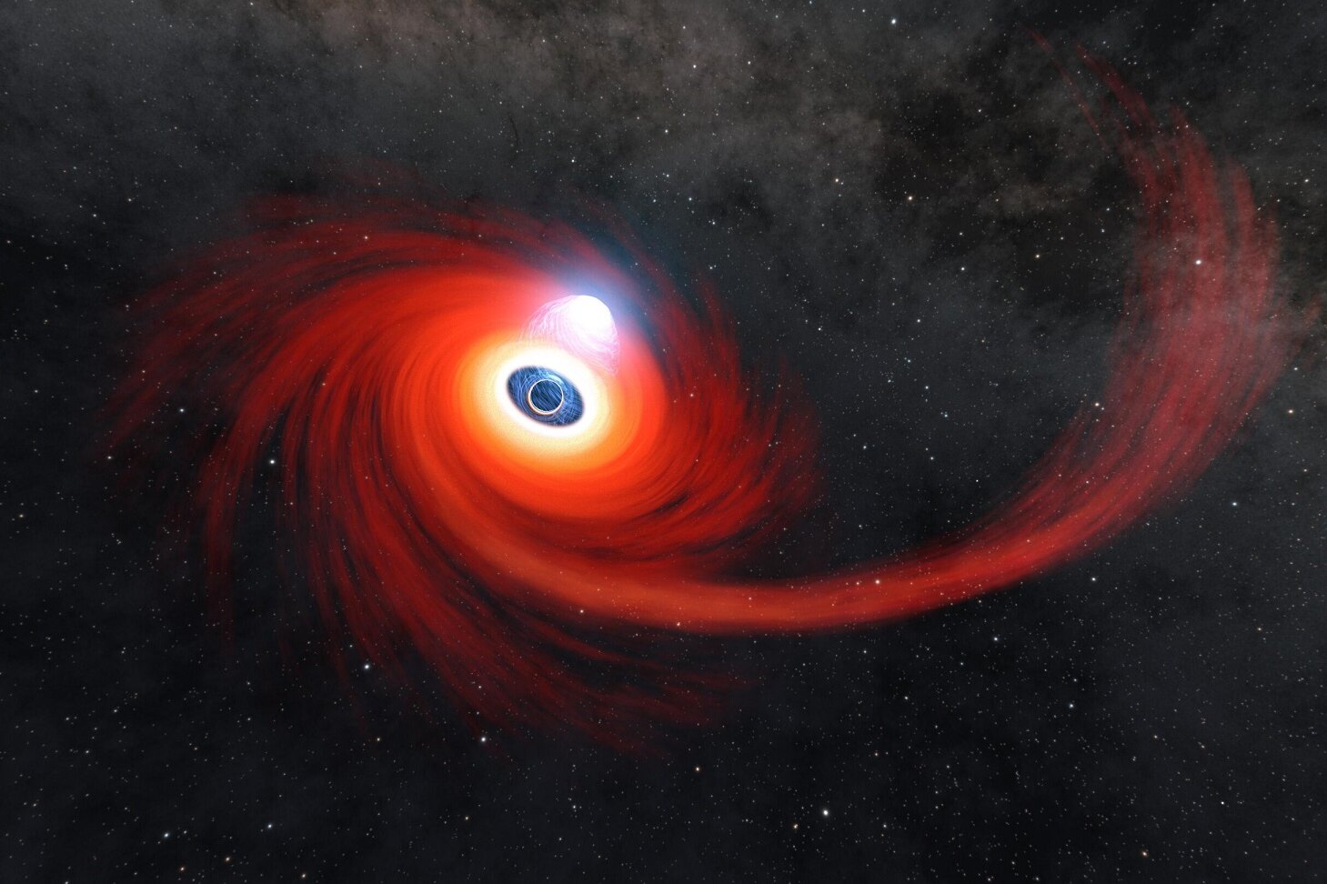 NASA получило необычайно точное изображение черной дыры, пожирающей звезду